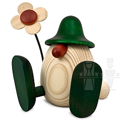 Egghead Erwin with flower sitting green