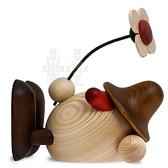 Egghead Oskar with flower lying brown