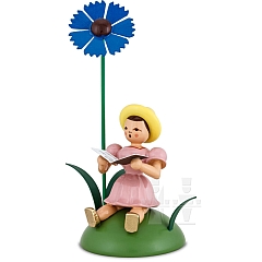 Flower Child colored sitting with Cornflower and Songbook