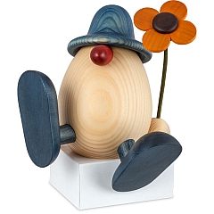 Egghead Father Alfons with flower sitting on edge or dancing blue