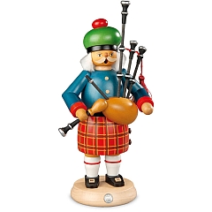 Smoker Scotsman in military dress with bagpipes